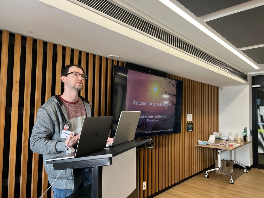 Scott Webster presenting "'A Home Among the Gumtrees': Bushfires, Memory and More-Than-Human Homes" (Sydney node)